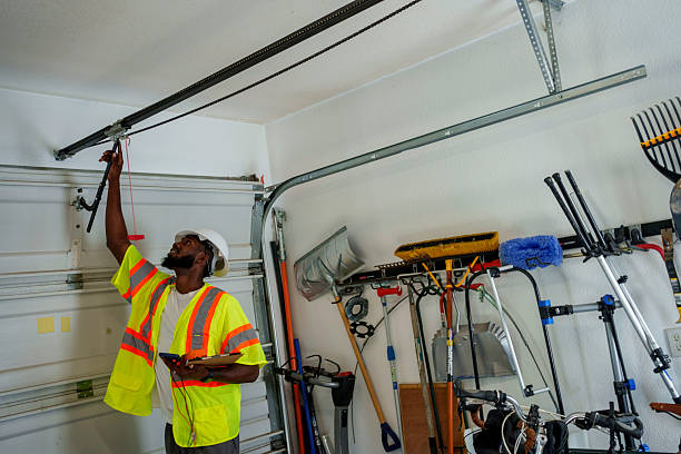 Professional Garage Door Spring Repair technician working in Methuen Town, MA